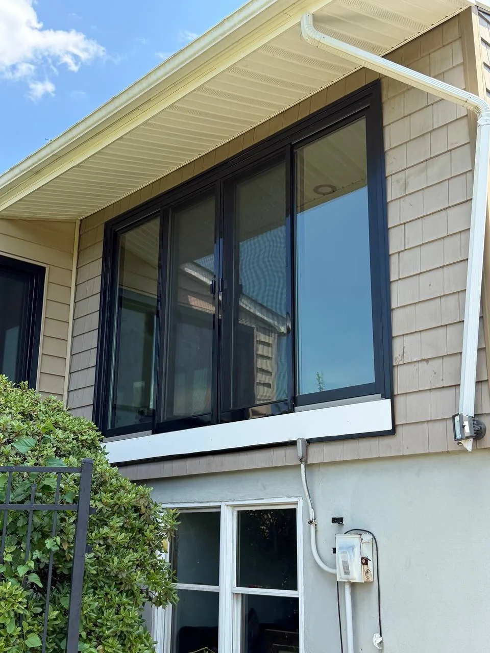 Black multi-panel patio door system